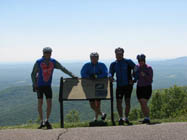 Riders pose for picture at a Blue Ridge Parkway overlook.